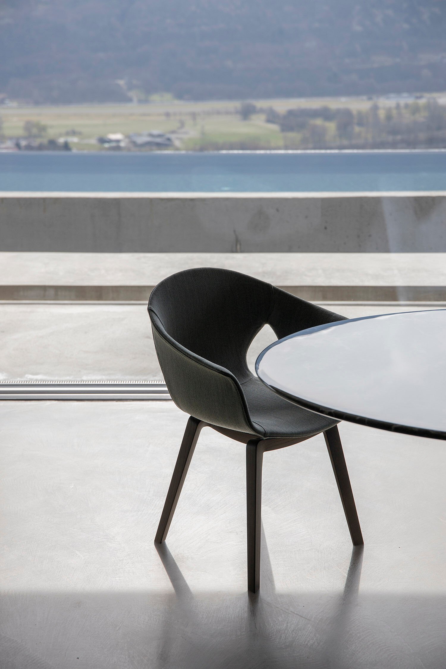 Modern Curved Brown Leather Armchair with Solid Dark Wood Legs Ergonomic Lounge Seat