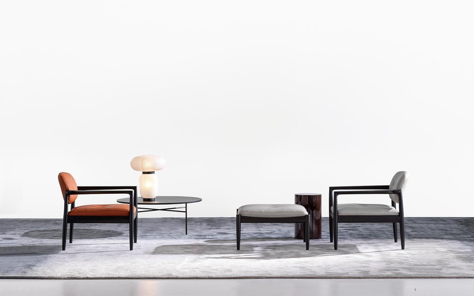 Sculpted Walnut Frame and Plush Channeled Cushioning Armchair with Footrest