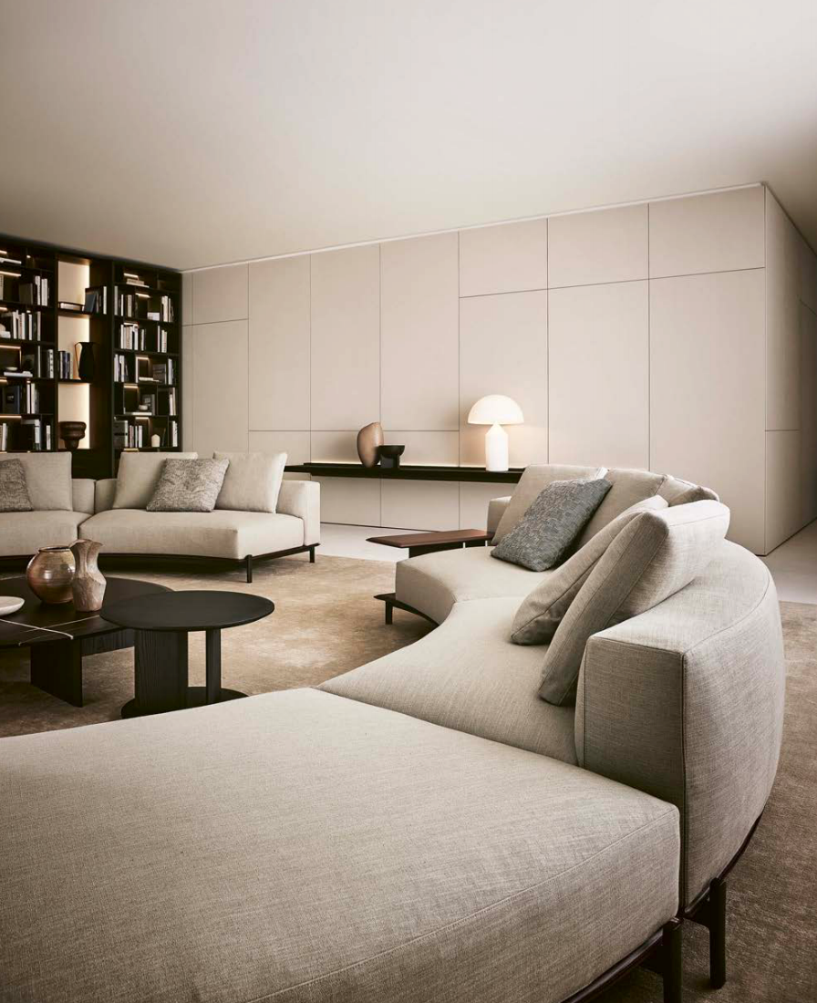 Sculptural Curved Sofa with Leather-Wrapped Base and Contrast Stitch Detailing