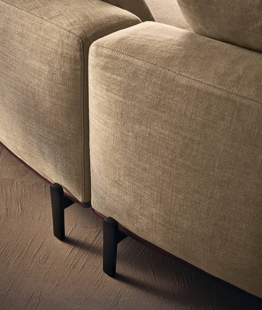 Sculptural Curved Sofa with Leather-Wrapped Base and Contrast Stitch Detailing