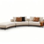 Sculptural Curved Sofa with Leather-Wrapped Base and Contrast Stitch Detailing