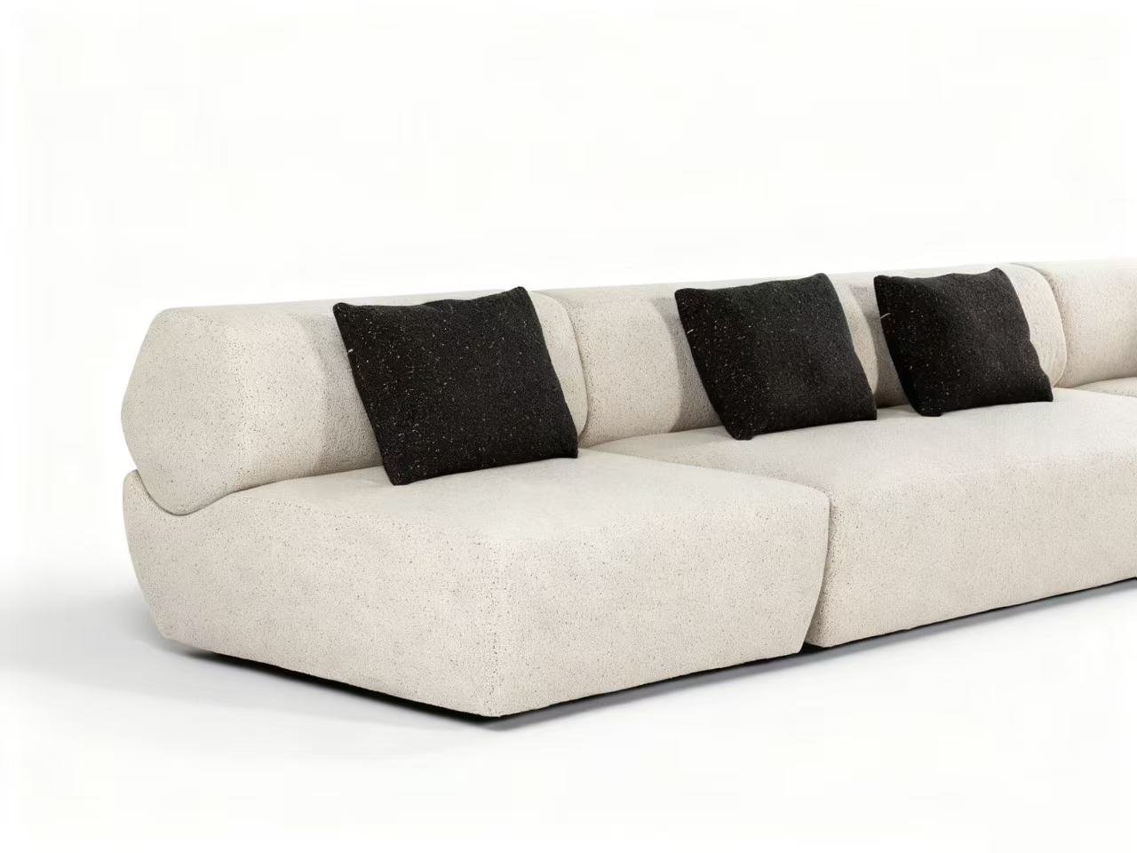 Flowing Modular Sofa with Ergonomic Support and Continuous Decorative Stitch