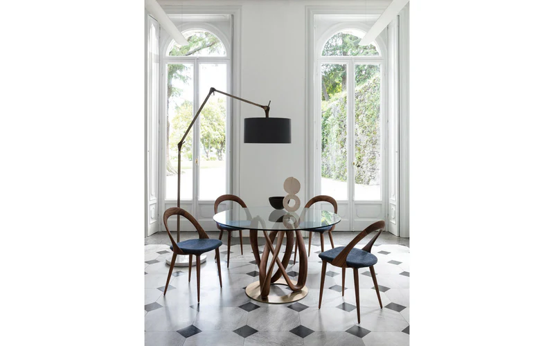 Round Glass Dining Table with Intertwined Wood Legs and Chrome Base