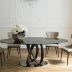 Round Glass Dining Table with Intertwined Wood Legs and Chrome Base