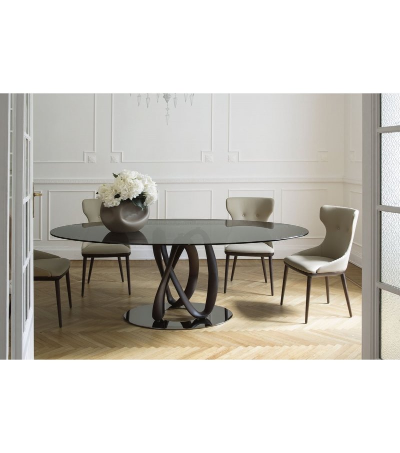 Round Glass Dining Table with Intertwined Wood Legs and Chrome Base
