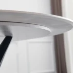 Round White Marble Dining Table with Sculpted Black Wood Base